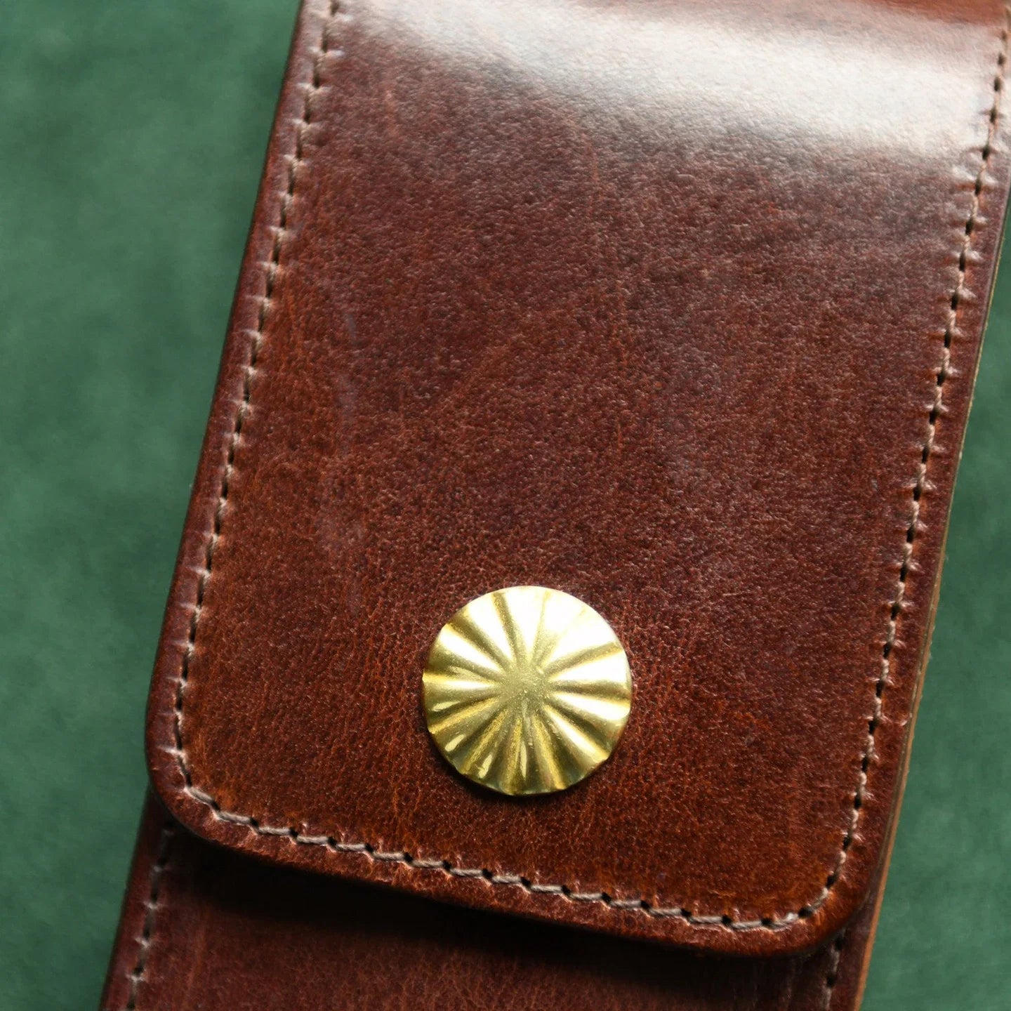 Coffee brown genuine leather pen case material and hand stitching detail