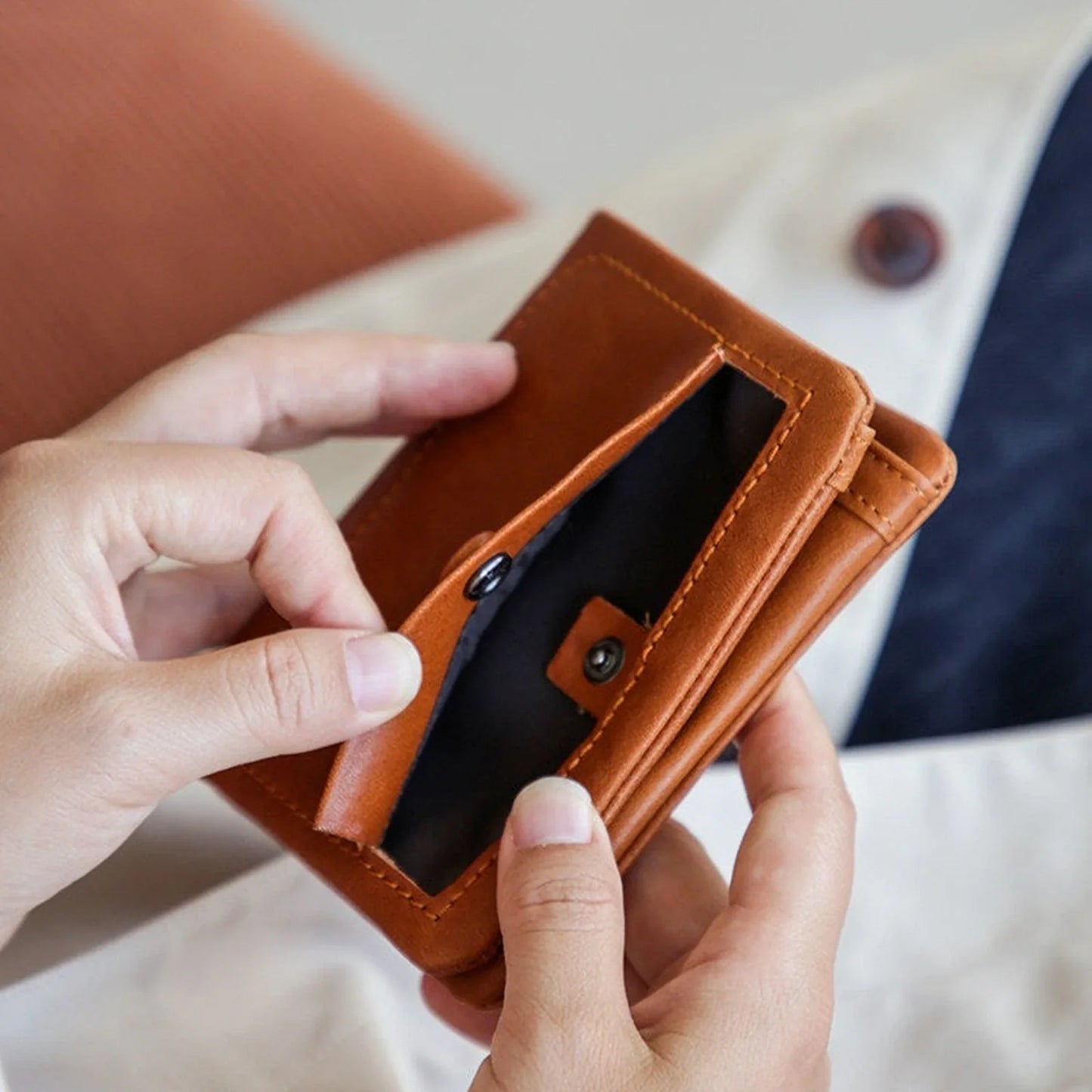 Cognac leather wallet snap coin pocket detail