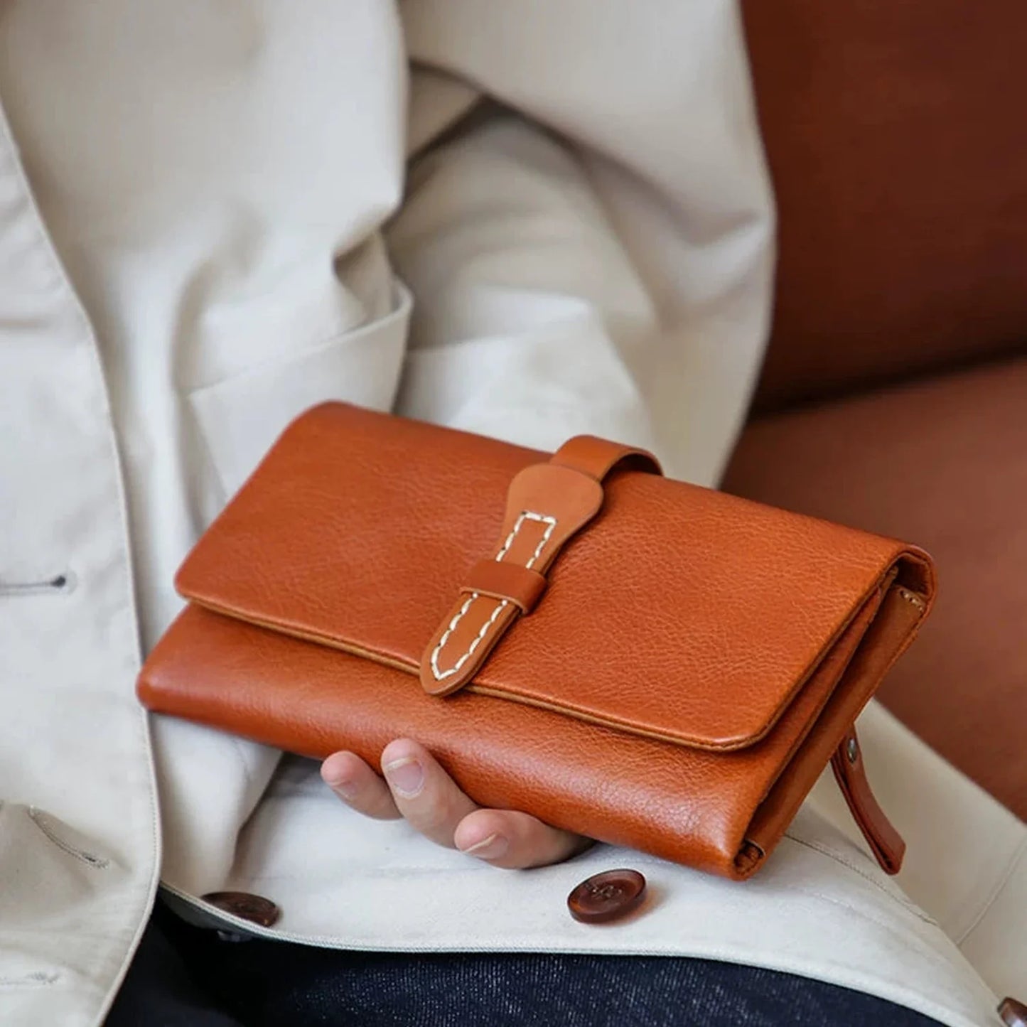 Cognac vegetable-tanned leather long wallet styled on the lap