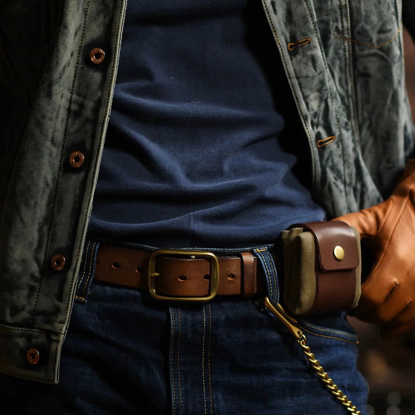 Compact canvas and leather-trim belt pouch worn closed