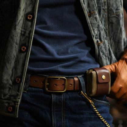 Compact canvas and leather-trim belt pouch worn closed