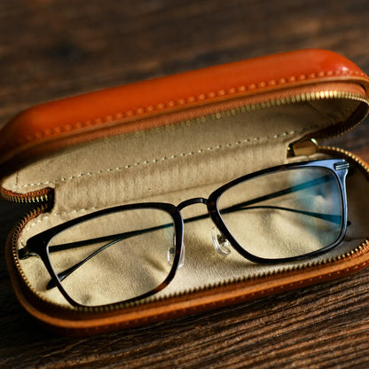 Open vegetable-tanned leather eyeglass case with protective interior