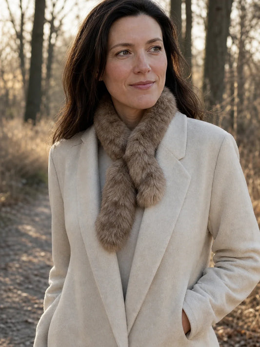 Light Brown sable fur mini scarf styled with an ivory coat outdoors