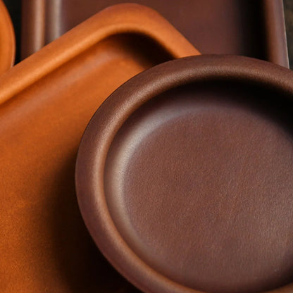 Round and square cowhide valet trays in Brown and Coffee Brown