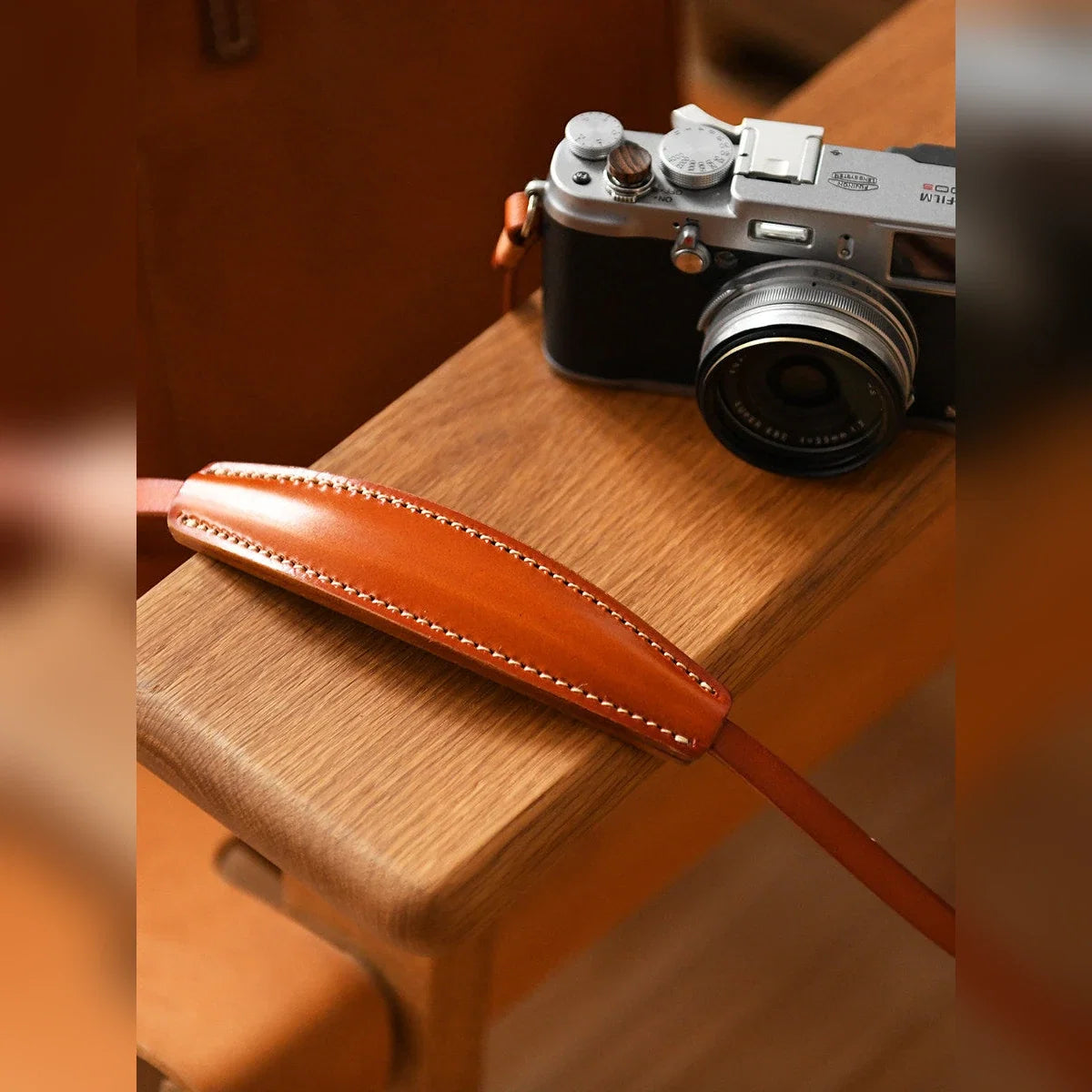 Cowhide leather camera strap shoulder pad and stitching detail