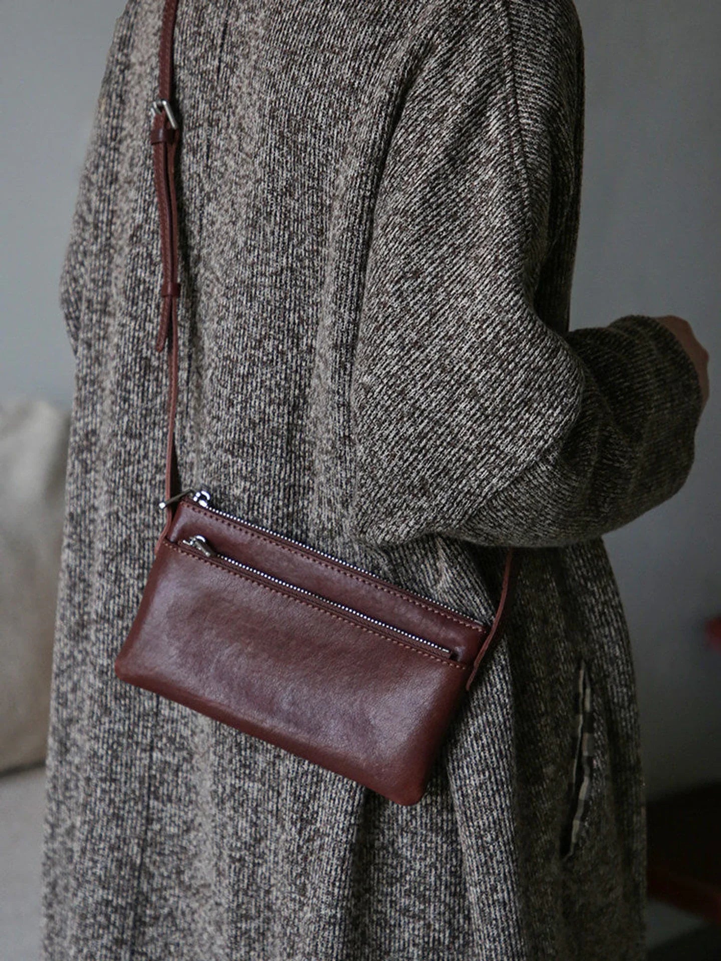 Coffee brown top-grain leather slim phone bag worn crossbody