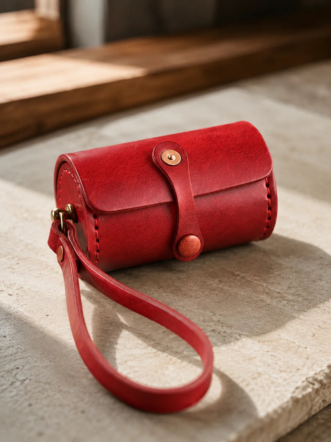 Vegetable-tanned cowhide wristlet case in red