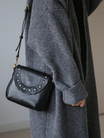 Black vegetable-tanned leather scalloped flap crossbody bag