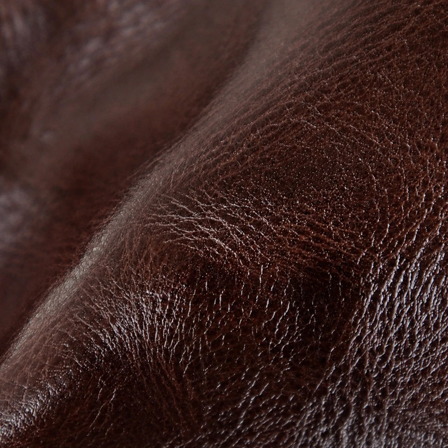 Close-up detail of the brown vegetable-tanned top-grain leather texture