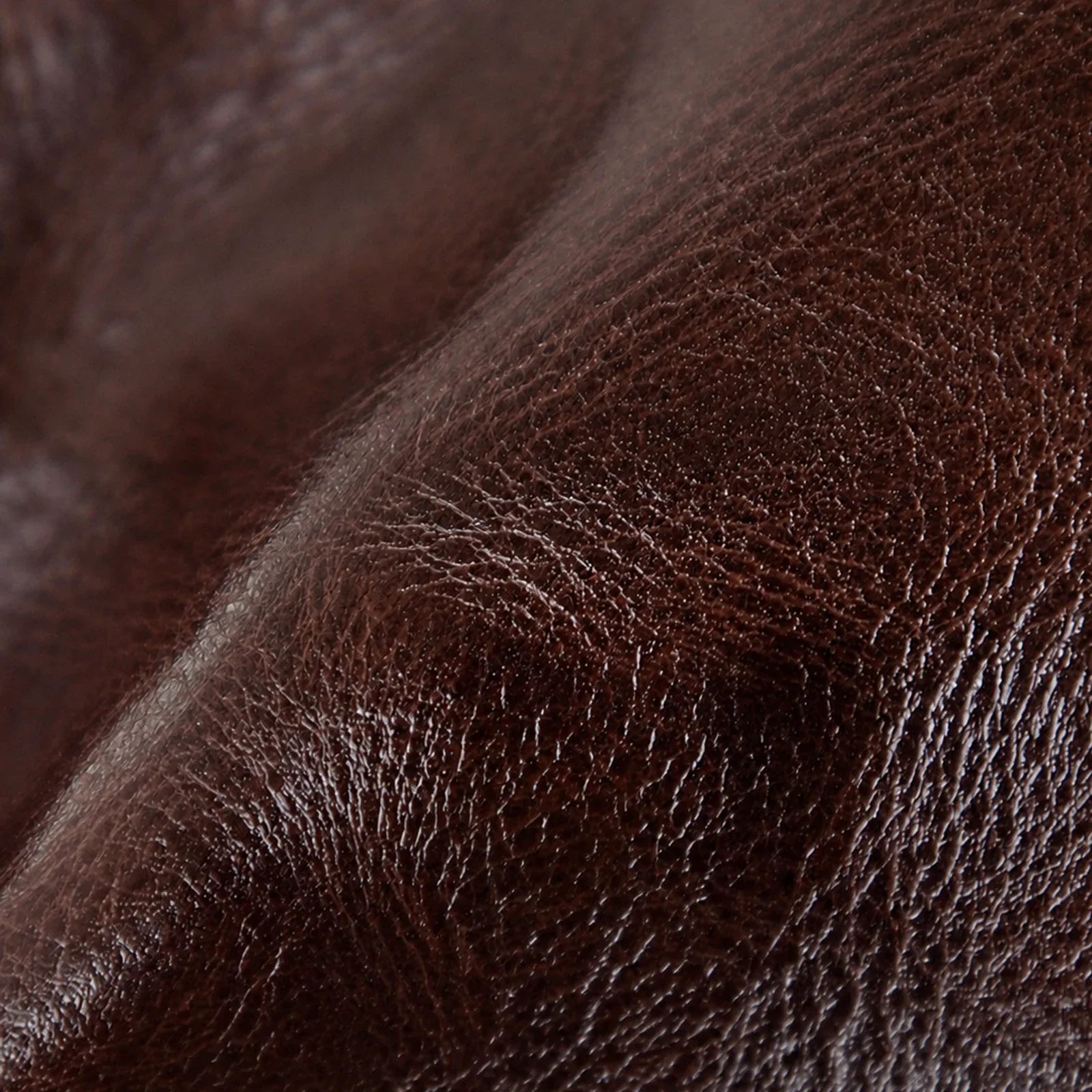 Close-up detail of the brown vegetable-tanned top-grain leather texture