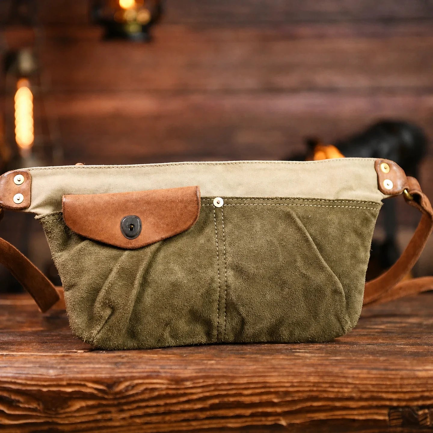 Close-up of washed canvas texture, front pocket and stitched panels