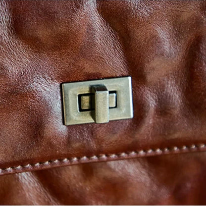Close-up of the vintage-style turn lock and top-grain leather texture