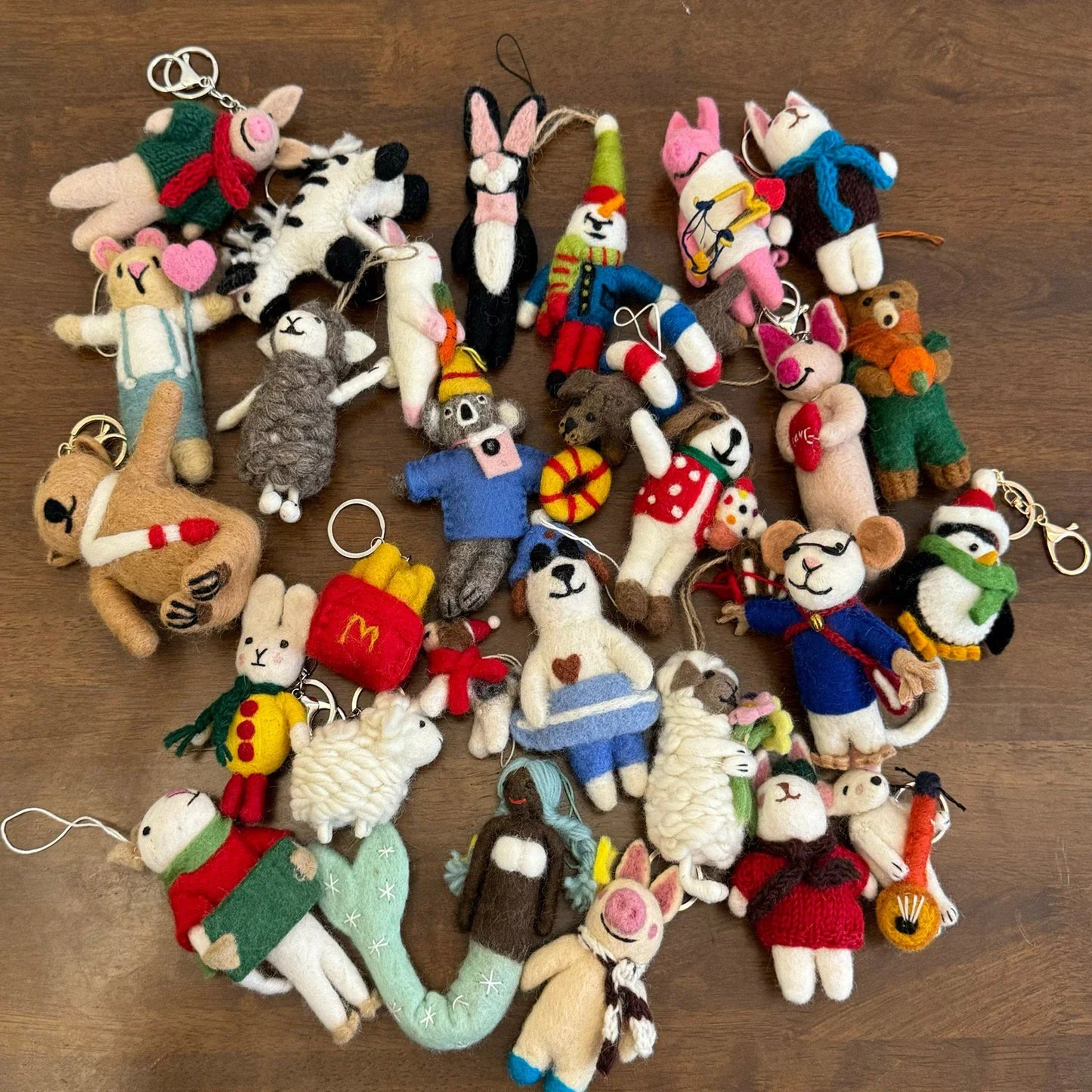 Assorted handmade wool felt animal bag charms with individual details