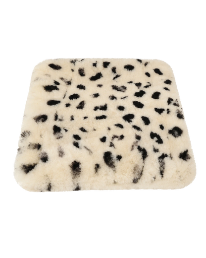 Big Leopard Spot genuine short-pile sheared-sheepskin patchwork chair pad on transparent background
