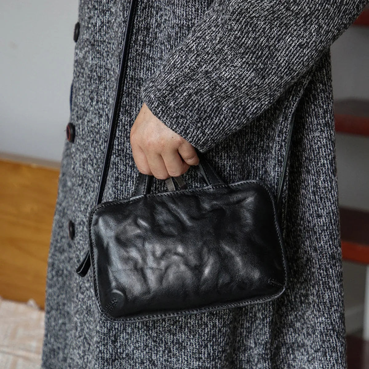 Black top-grain cowhide mini crossbody bag with top handle