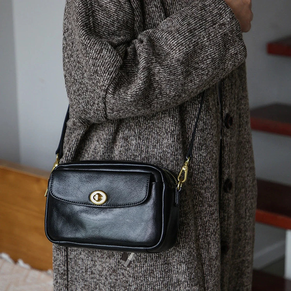 Black top-grain cowhide compact crossbody bag front view