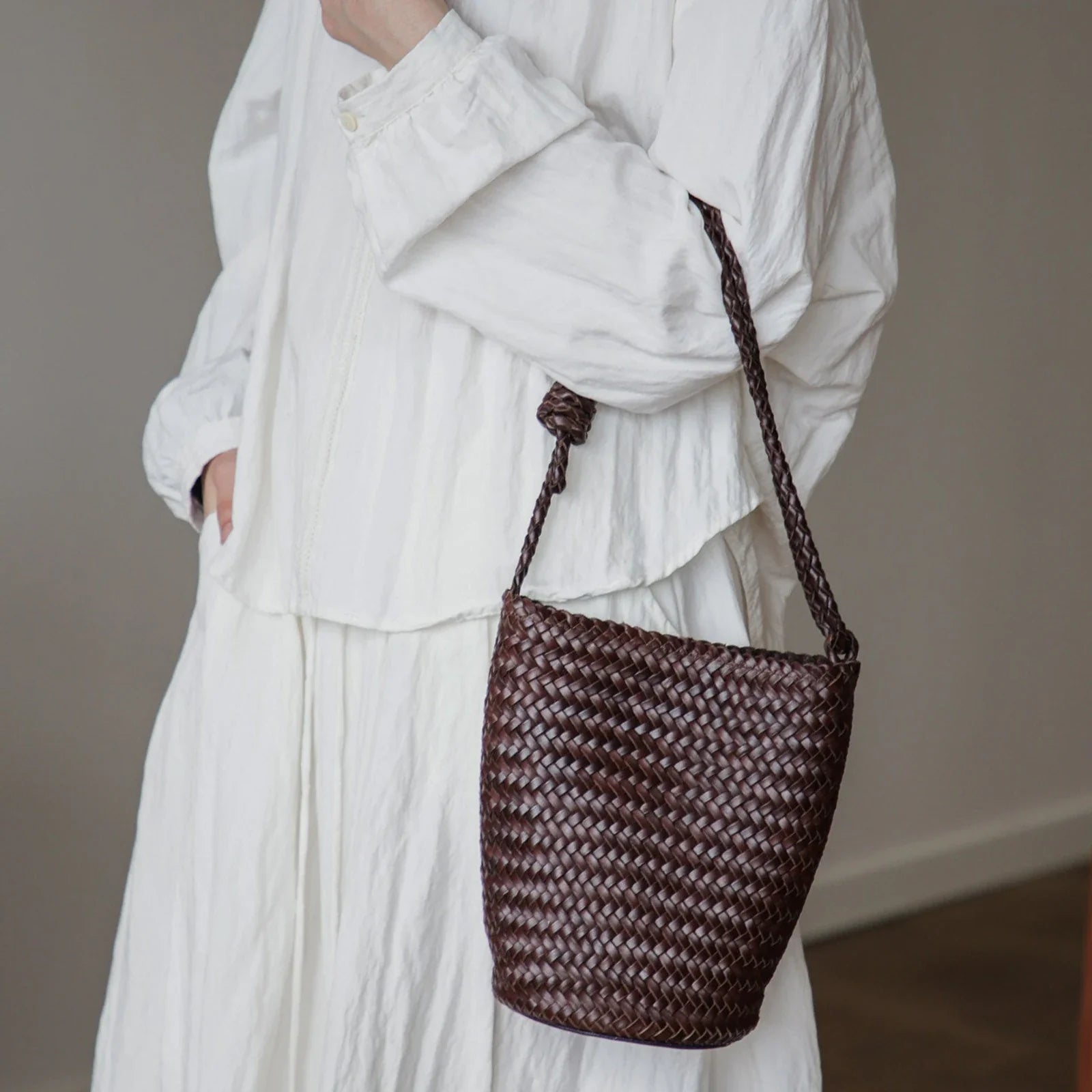 Coffee brown woven leather bucket bag with braided strap