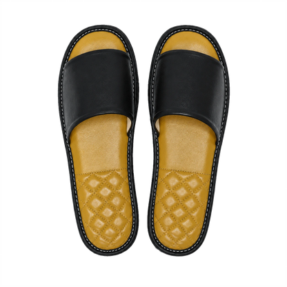 Black lambskin leather open-toe slippers with amber footbeds on a transparent background