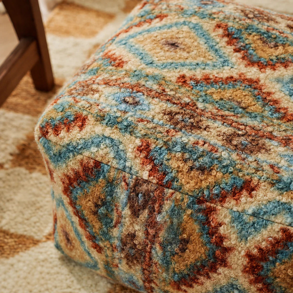 Close view of the raised Fair Isle geometric texture and cushion seams