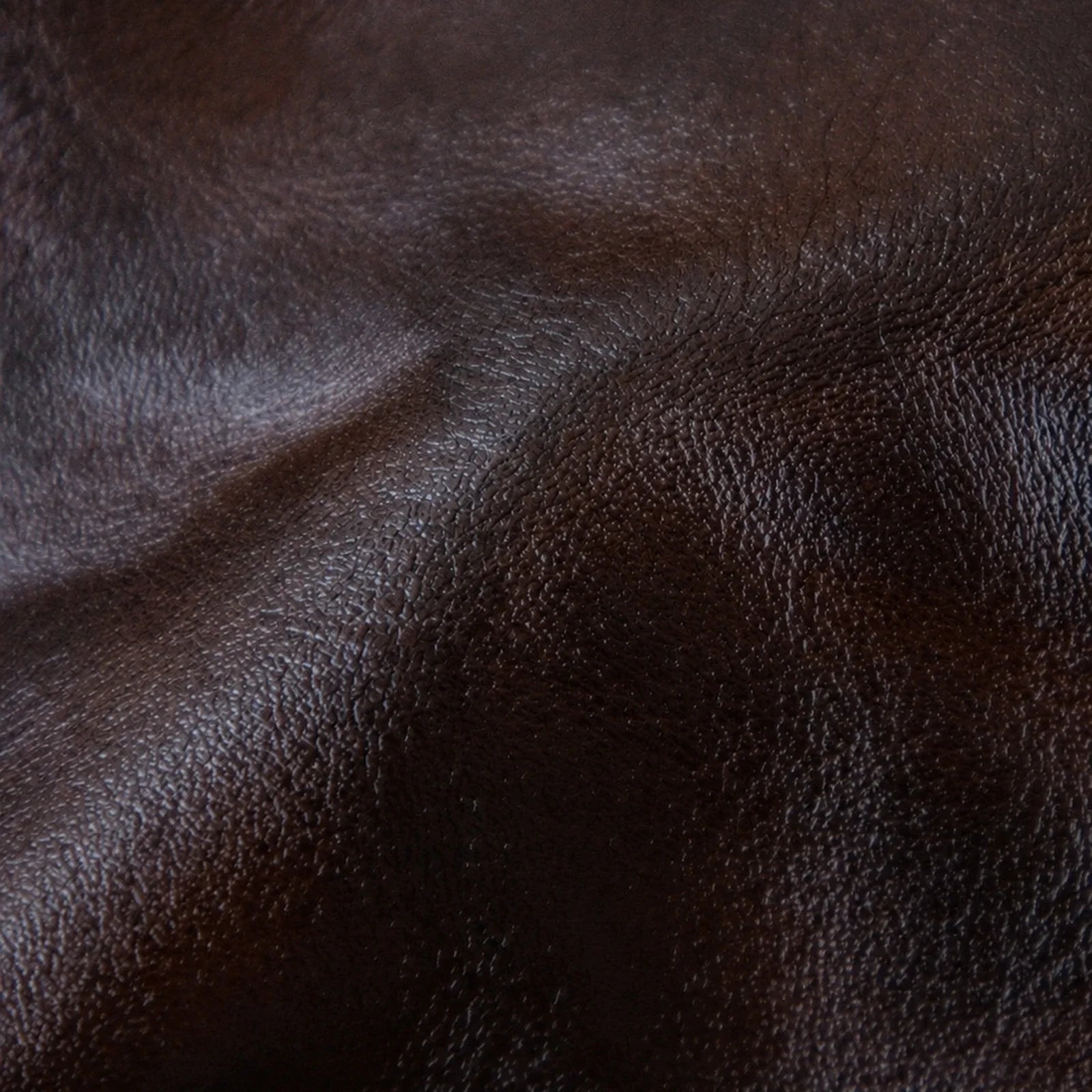 Hand-crumpled top-grain cowhide leather texture detail