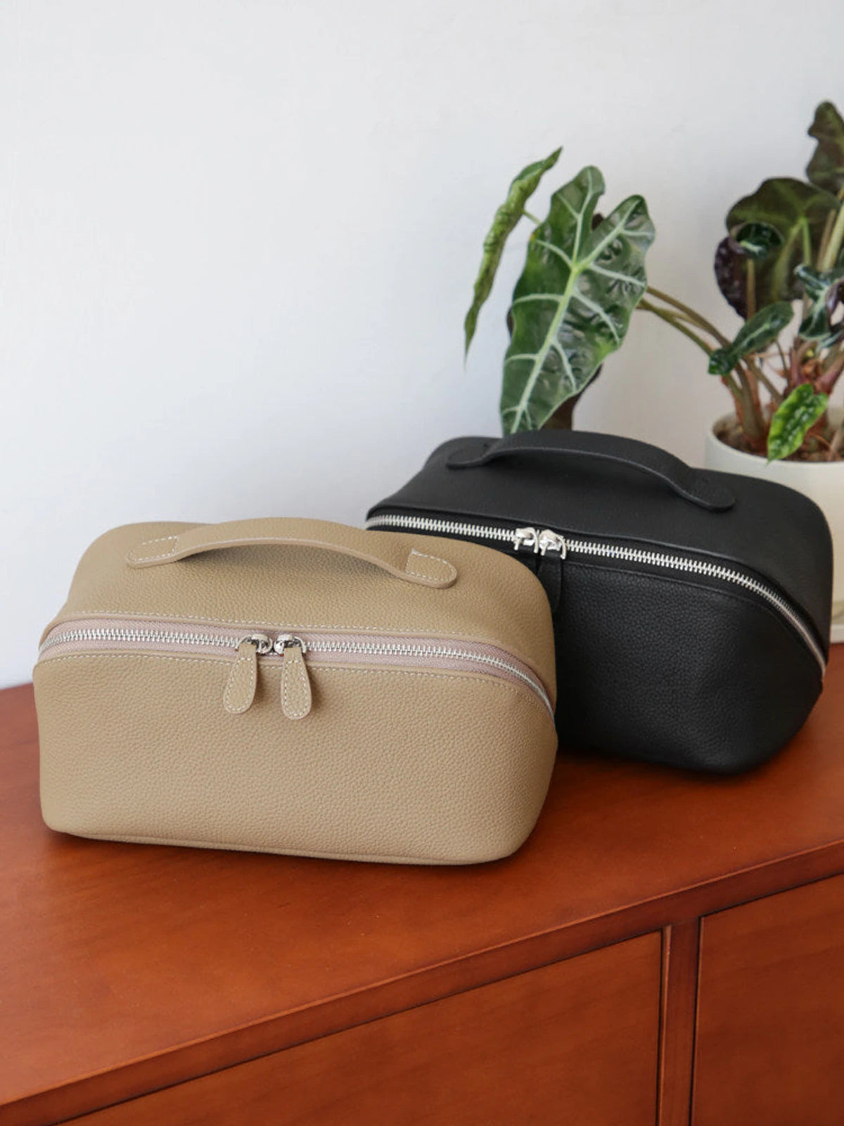 Top-grain cowhide leather cosmetic travel cases in trench gray, golden brown and black