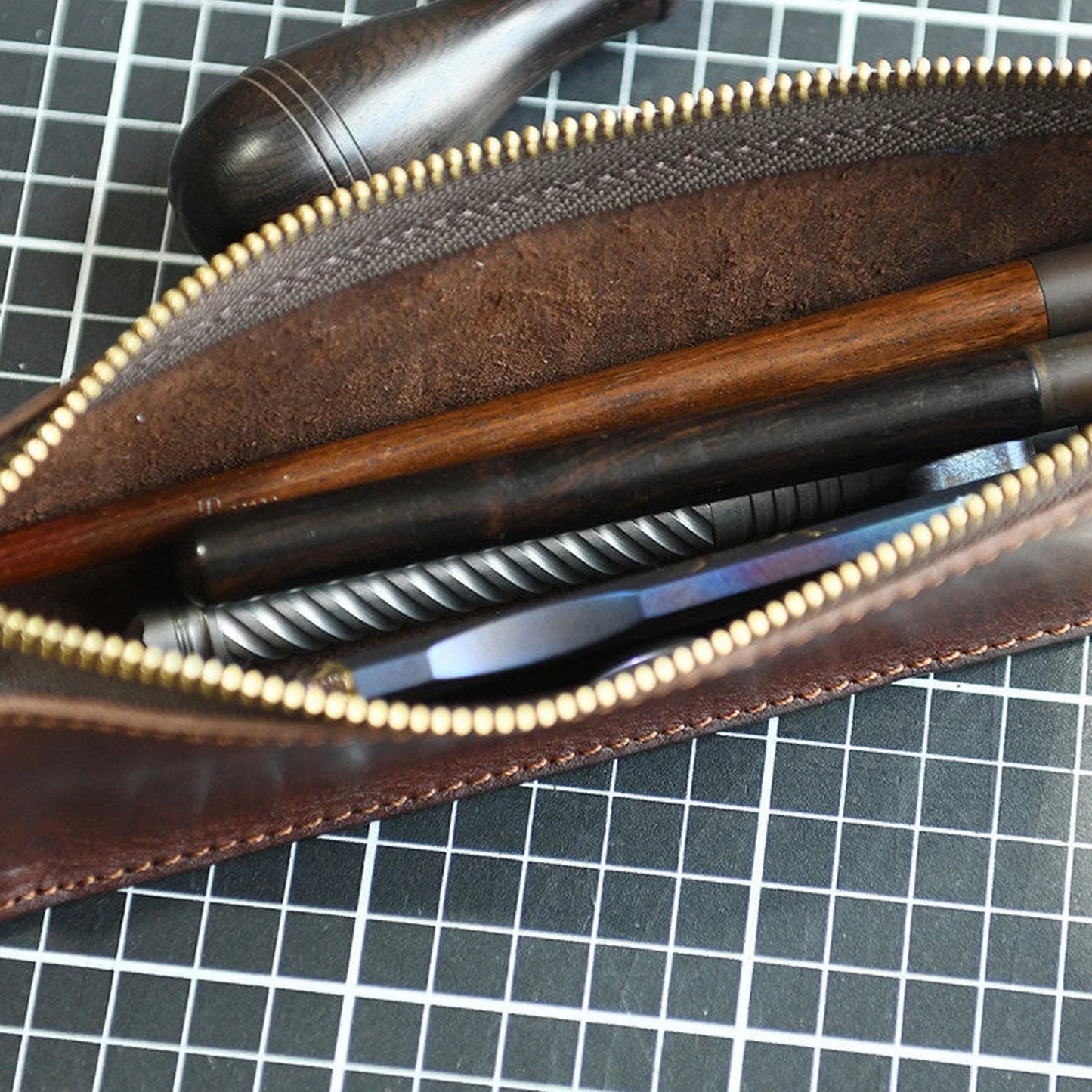 Leather pencil case interior with pens