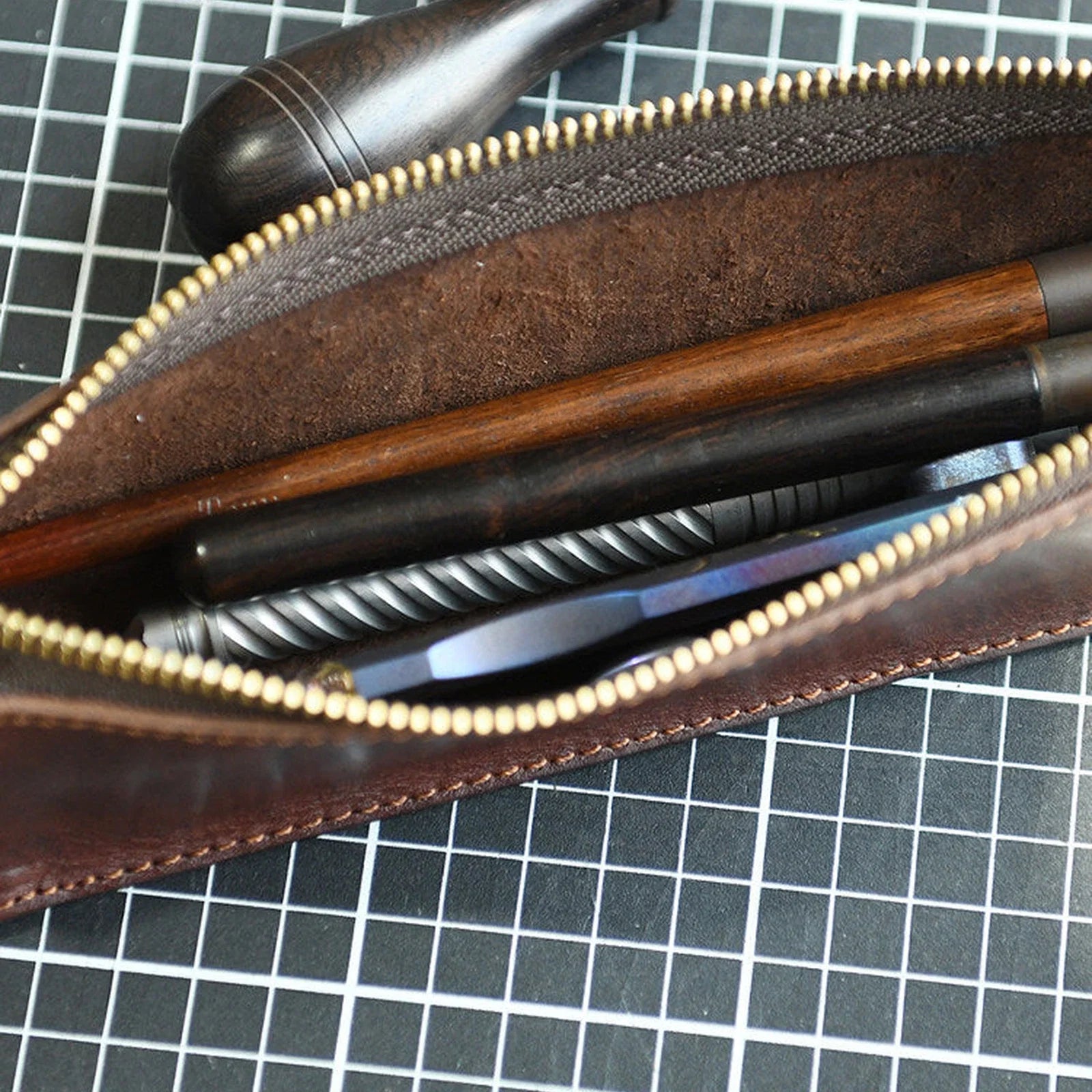 Leather pencil case interior with pens