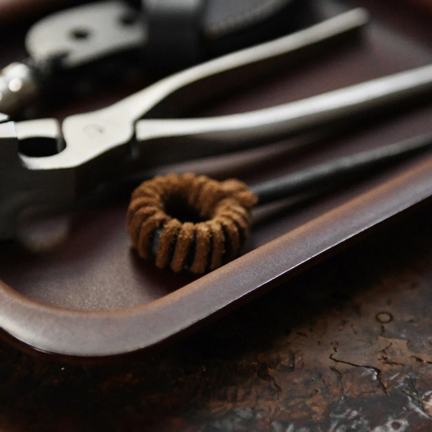 Molded cowhide valet tray edge and leather grain detail