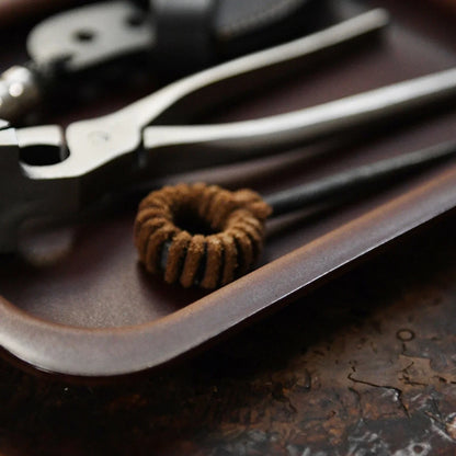 Molded cowhide valet tray edge and leather grain detail
