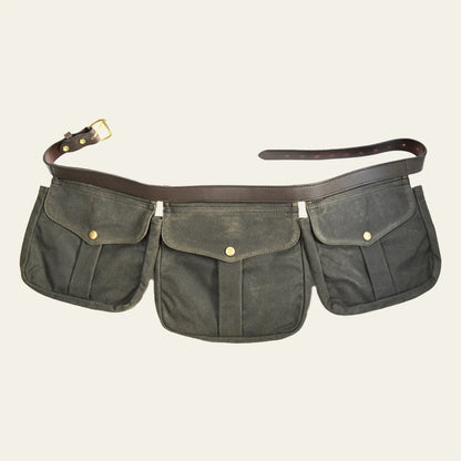 Multi-pocket canvas waist bag shown fully extended with its adjustable strap