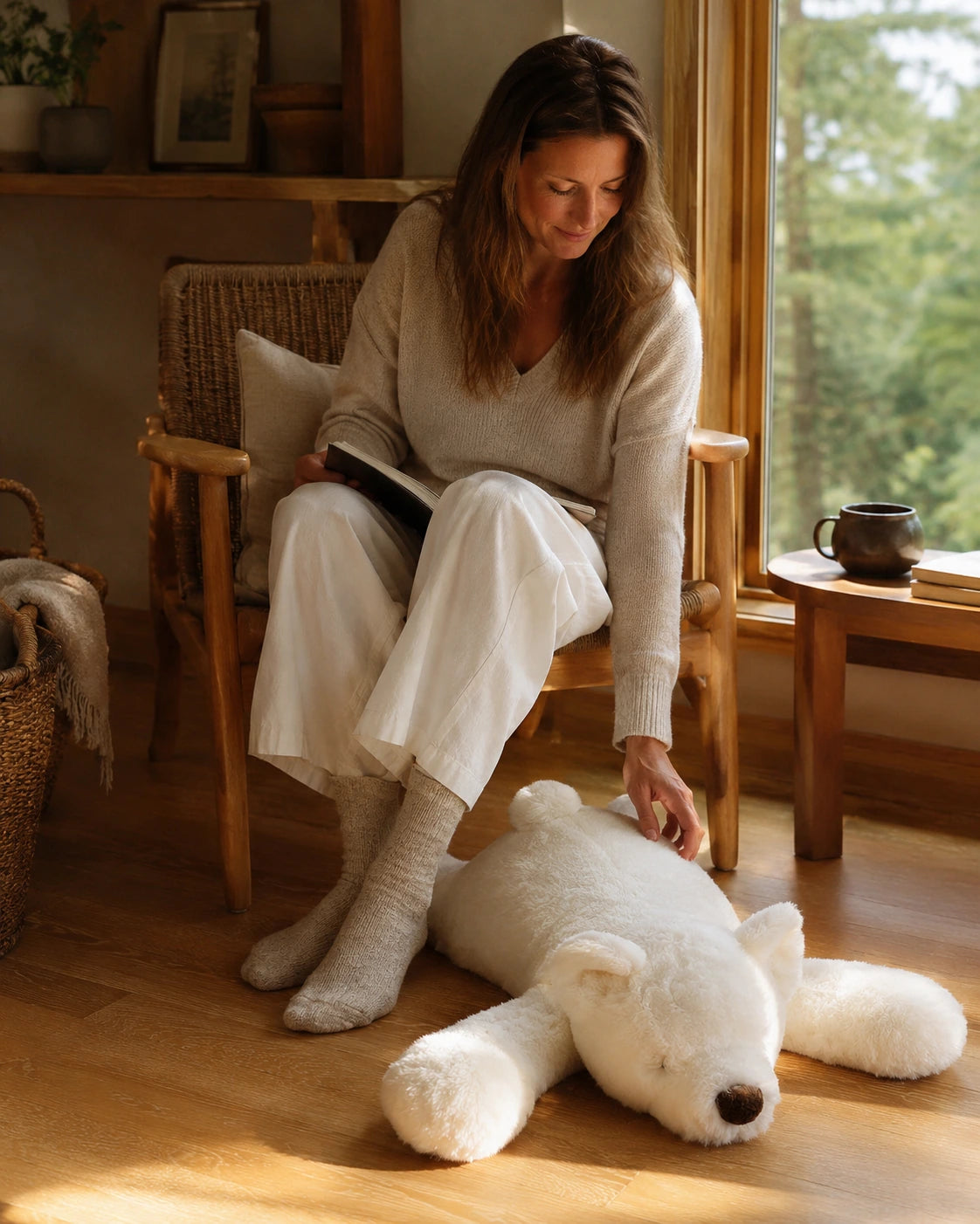 Woman using a Polar Bear genuine natural fur floor cushion in a reading room