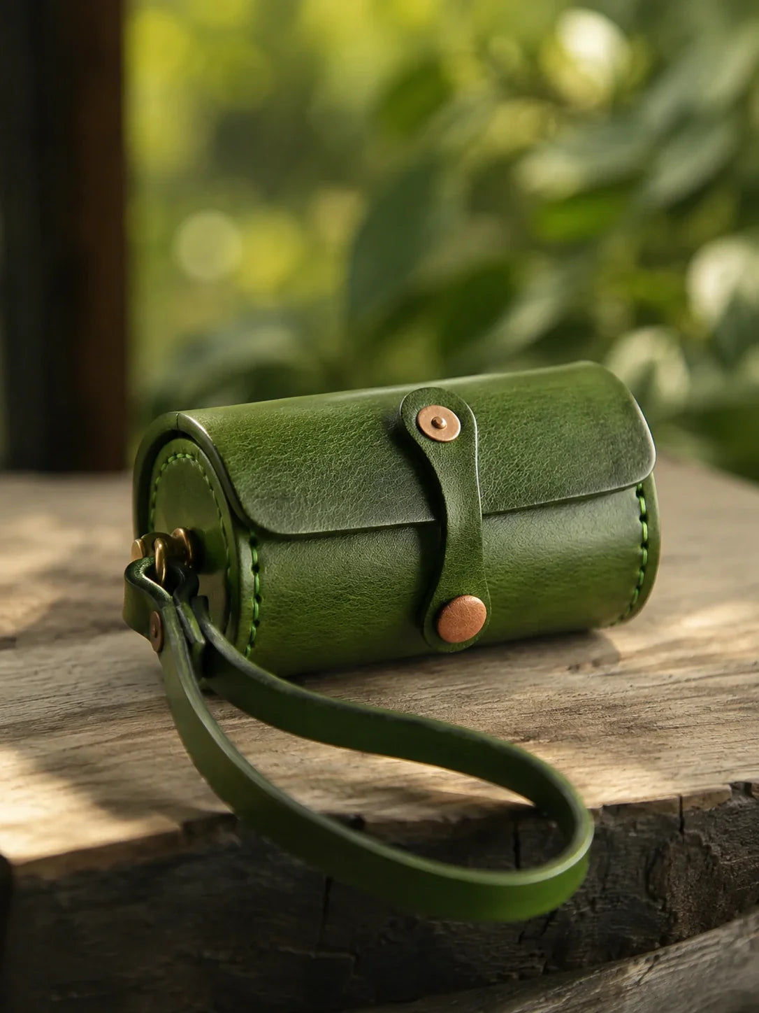 Vegetable-tanned cowhide wristlet case in dark green