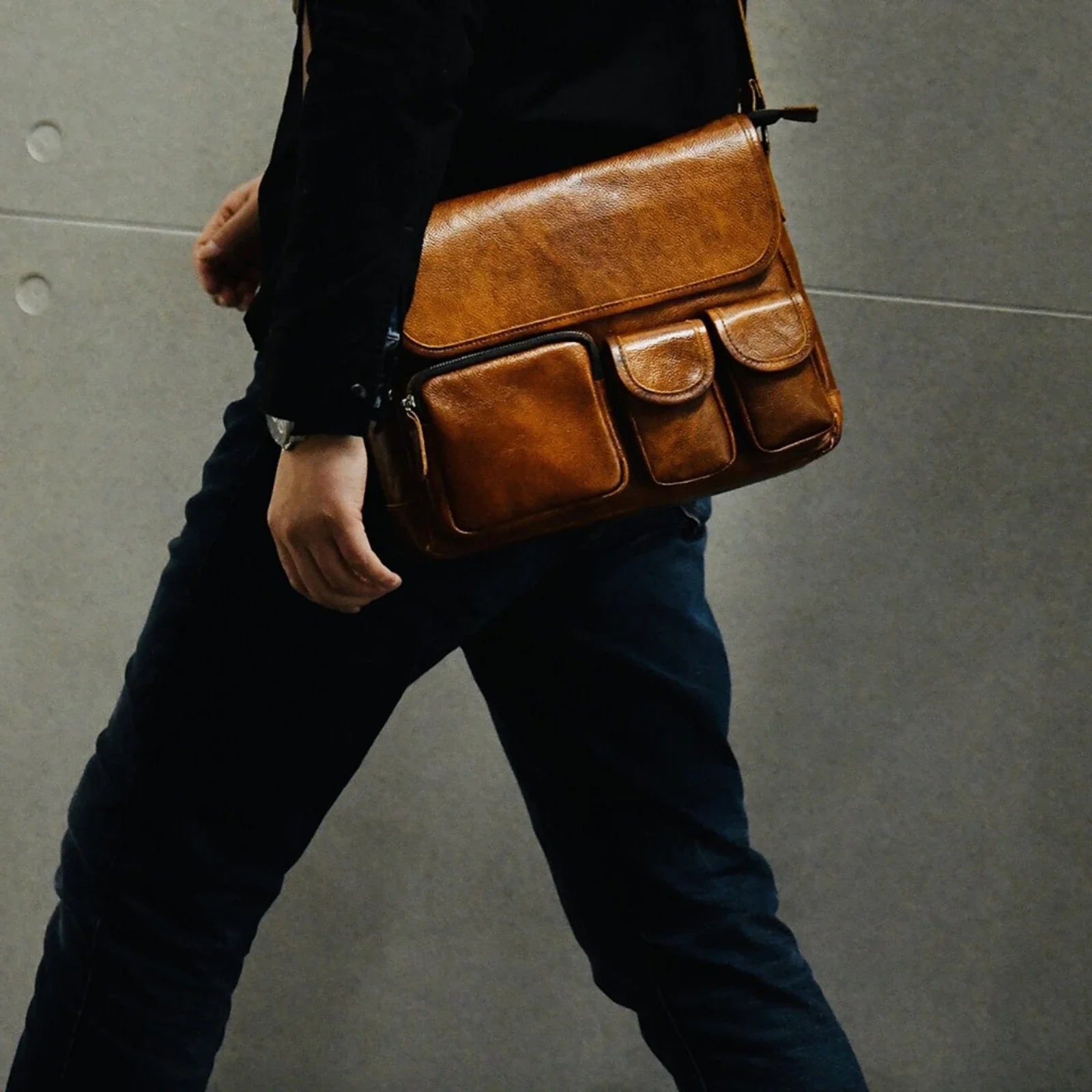 Vintage brown cowhide messenger bag worn crossbody