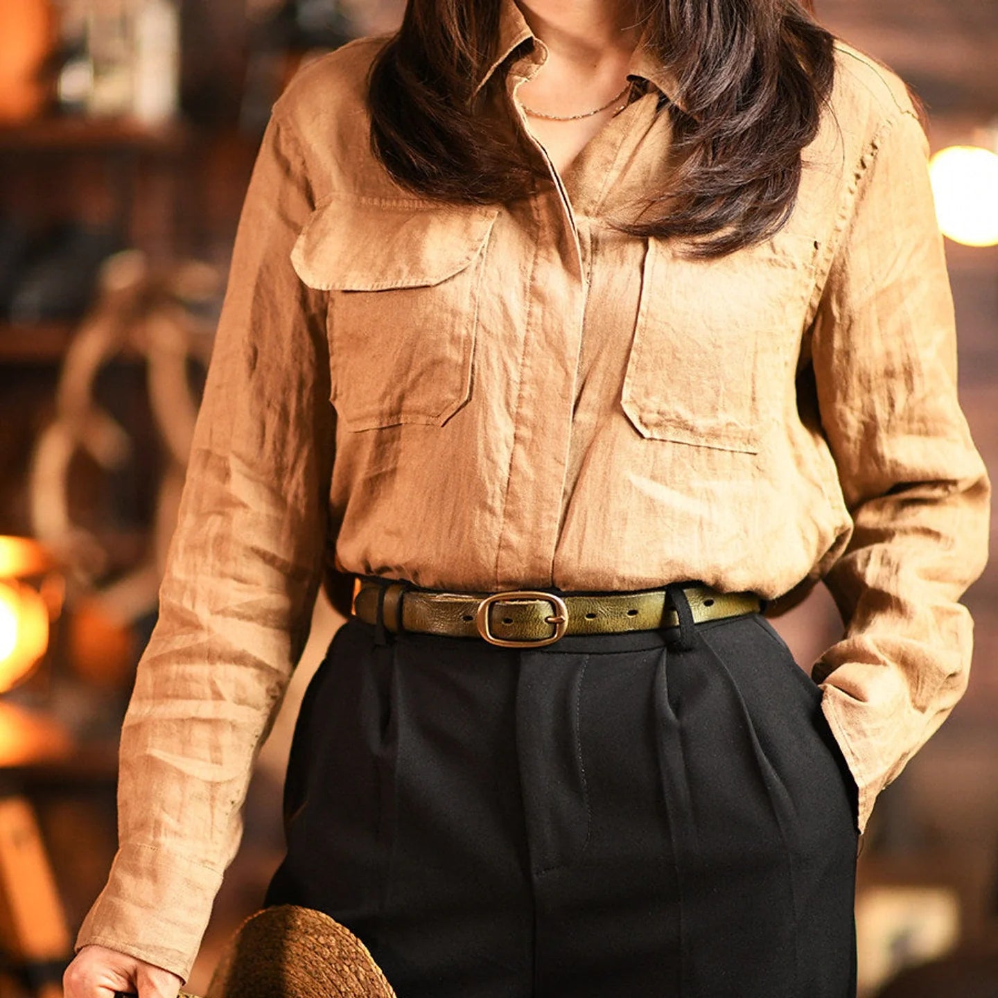 Women's distressed cowhide belt in black styled with tailored trousers