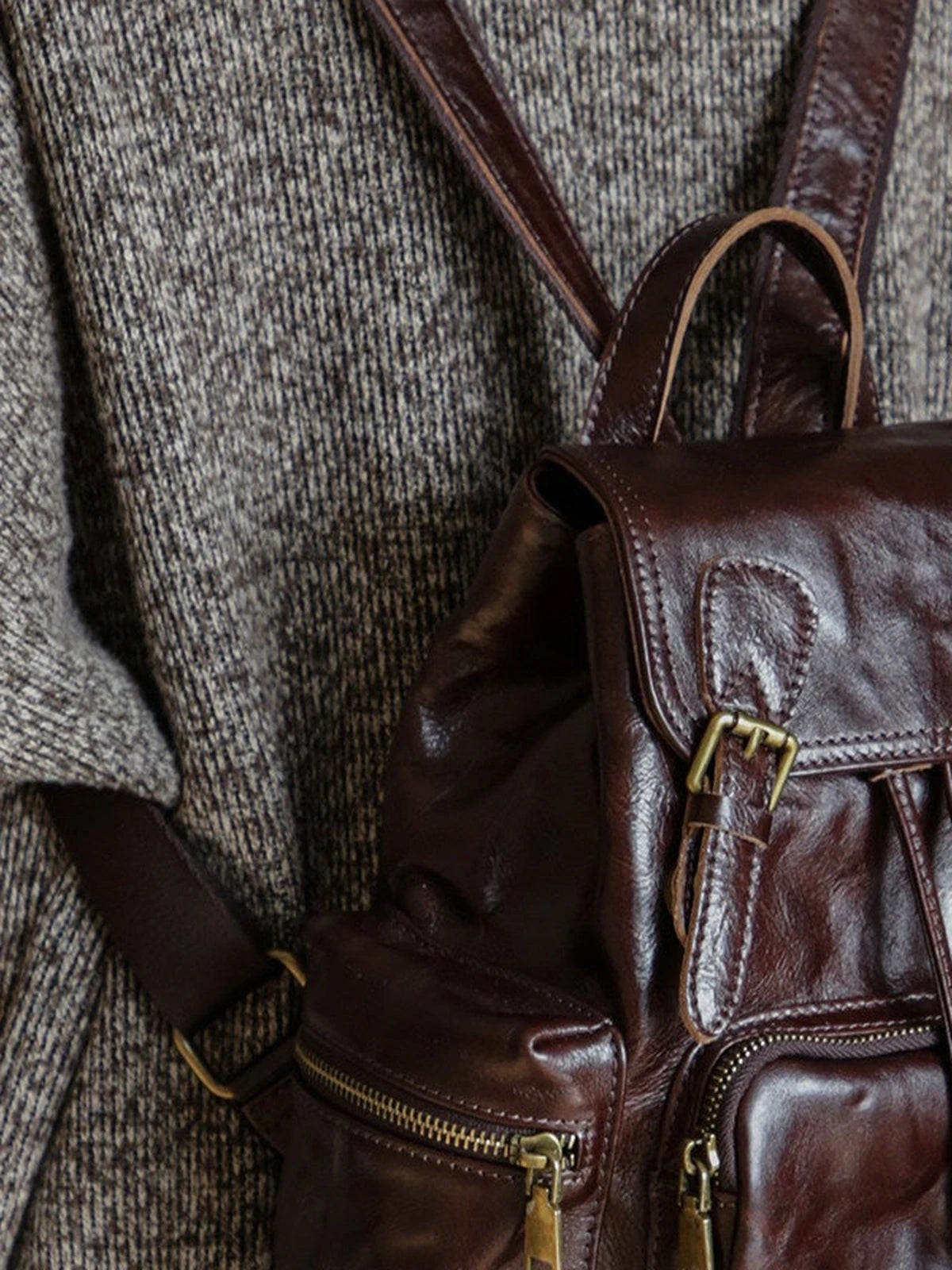 Coffee brown leather backpack zipper and hardware detail