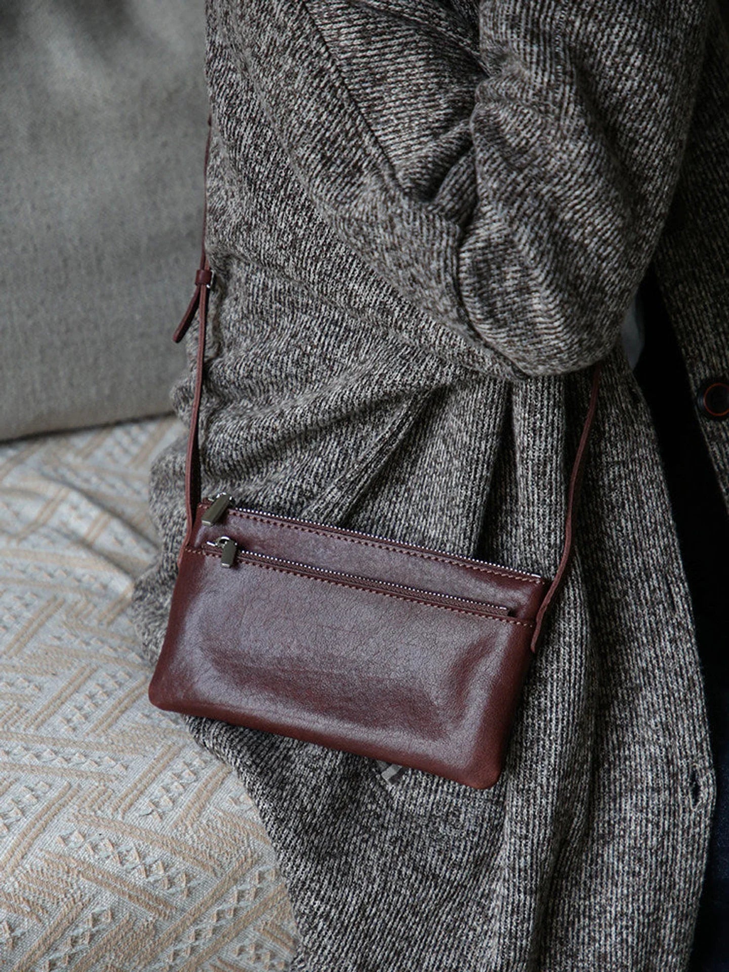 Coffee brown leather phone bag shown from the side