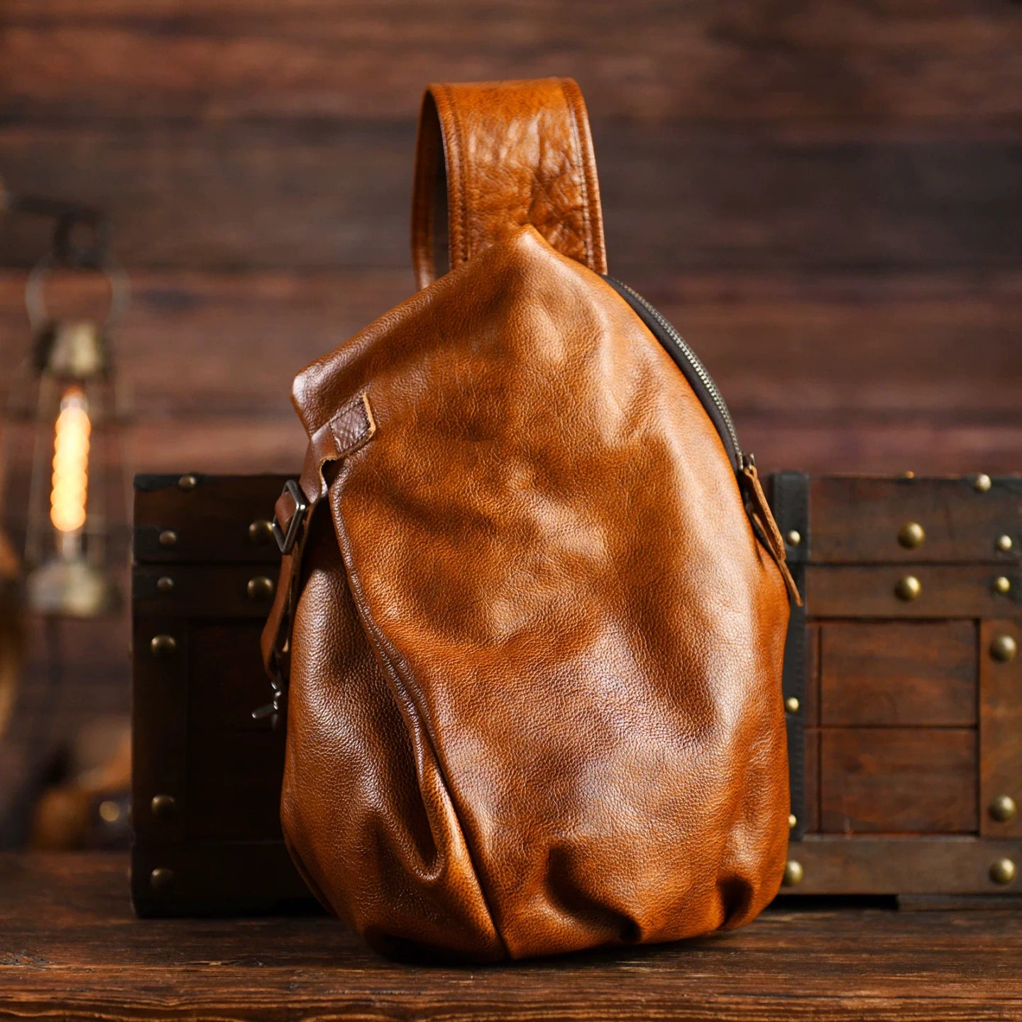 Vintage Brown cowhide leather sling chest bag, studio product view