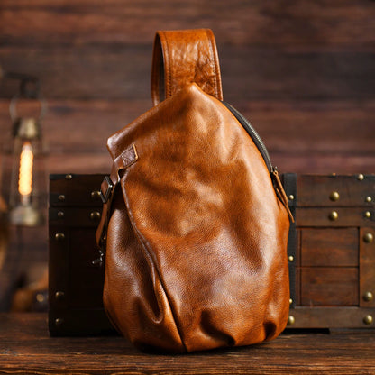 Vintage Brown cowhide leather sling chest bag, studio product view