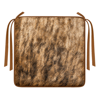 Golden brown brindle genuine cowhide square chair pad with leather border and tie straps on transparent background