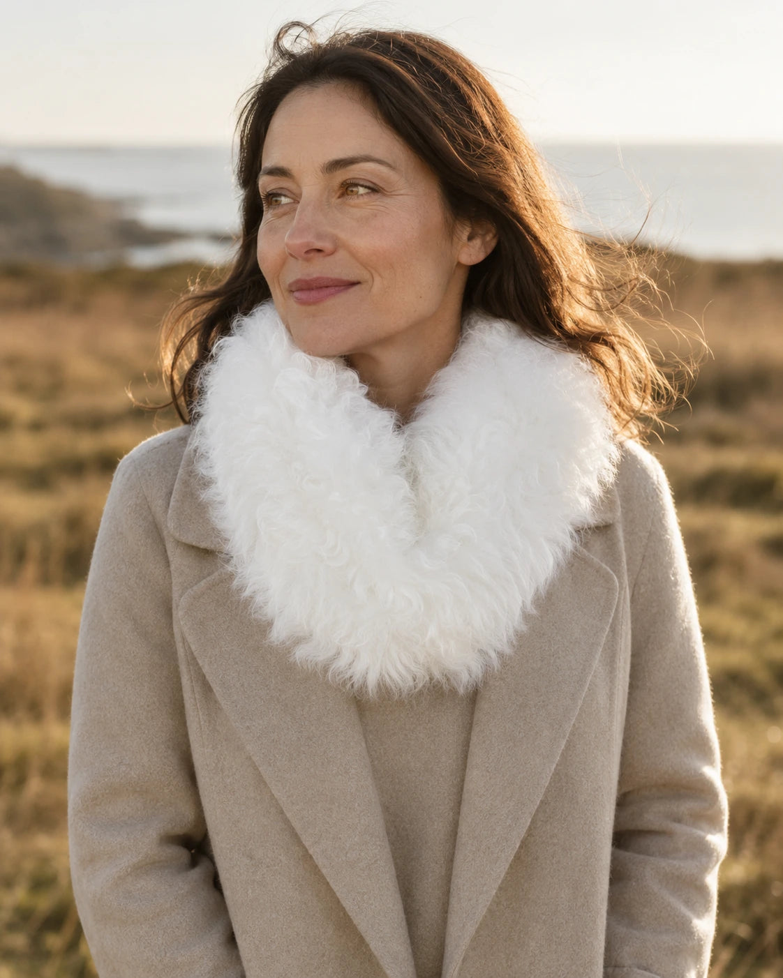 Adult woman wearing an Ivory White genuine lamb fur magnetic scarf with a wool coat