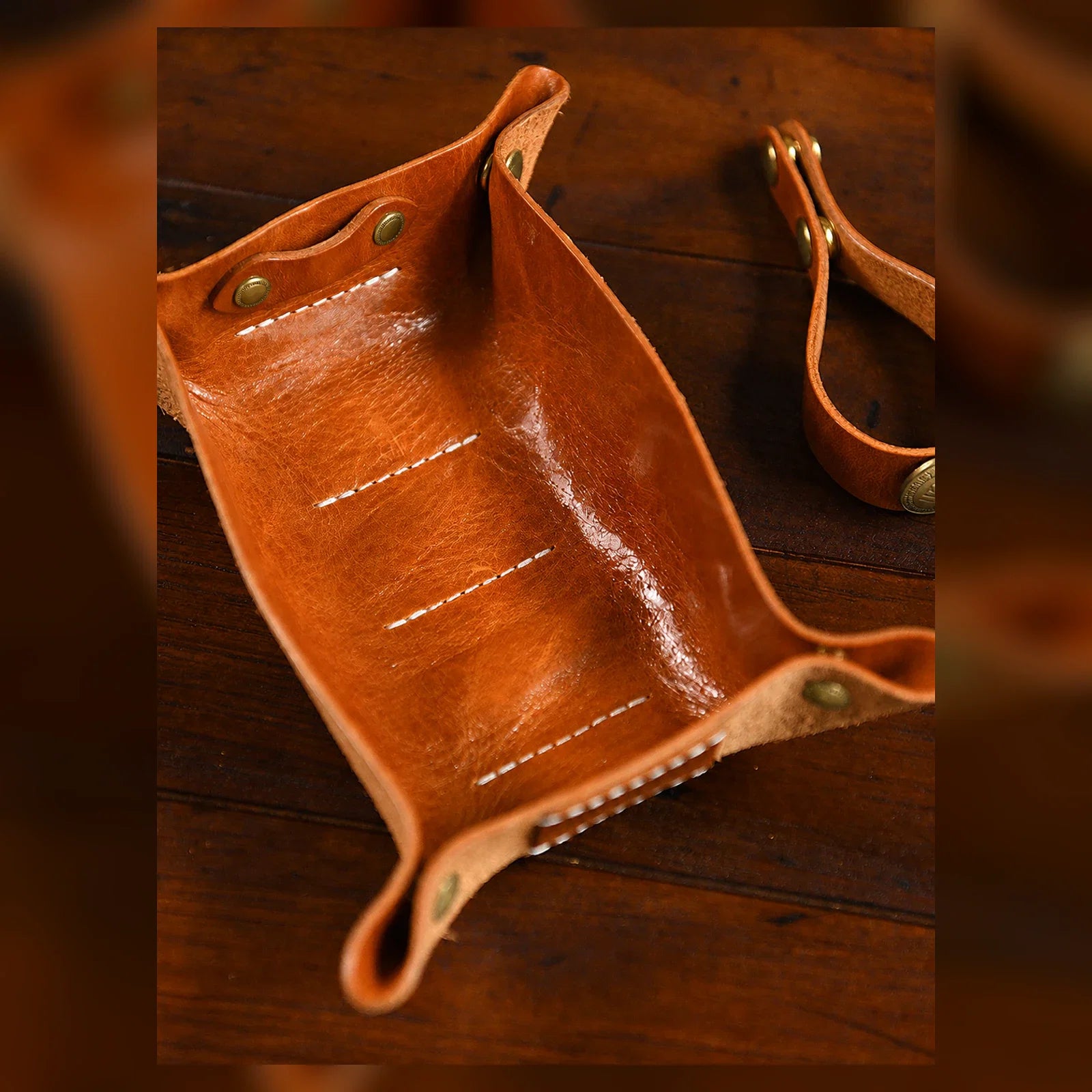 Interior of vegetable-tanned leather pipe pouch with stitched slots