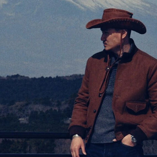 Man wearing the vintage brown cowhide western cowboy hat outdoors
