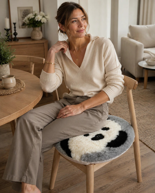 Panda genuine sheepskin round chair pad used on a wood dining chair