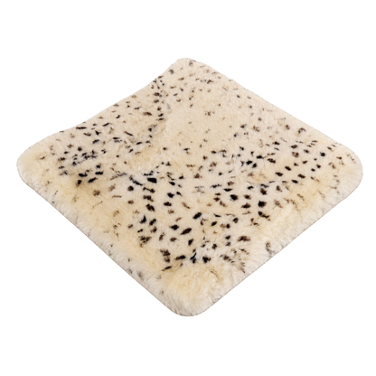 Small Leopard Spot genuine short-pile sheared-sheepskin patchwork chair pad on transparent background
