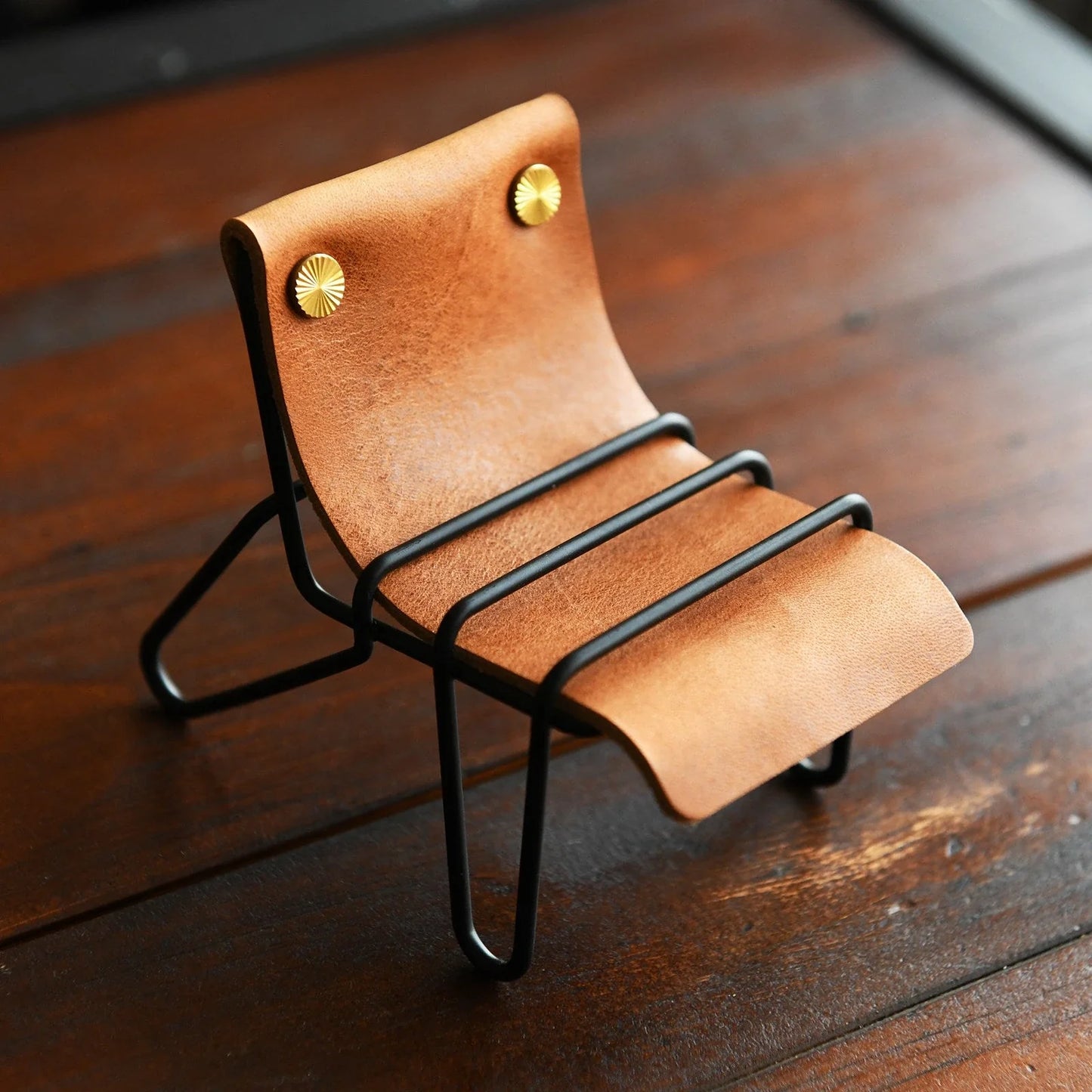 Sunset tan leather phone stand with black frame