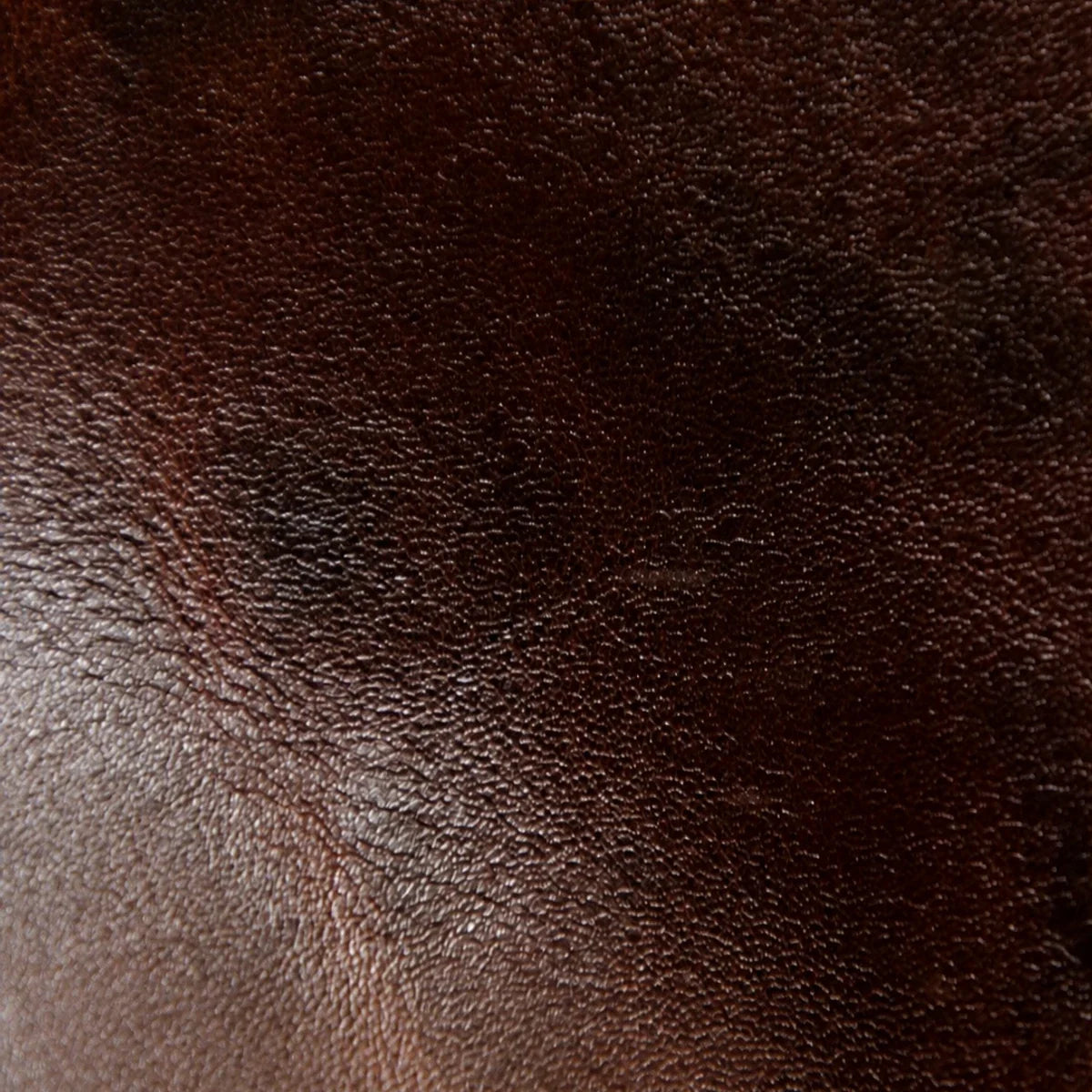 Close-up detail of brown vegetable-tanned cowhide grain