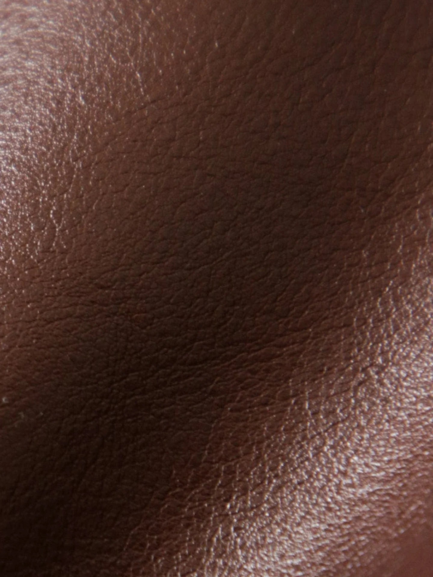 Close view of the natural grain and luster of vegetable-tanned leather