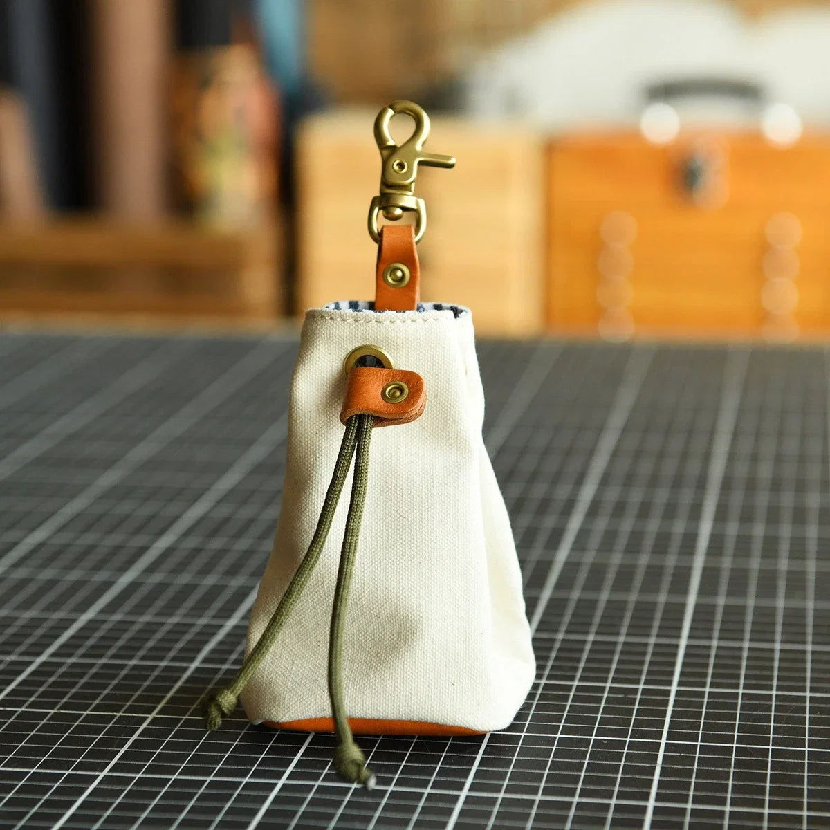 White canvas and leather drawstring storage pouch