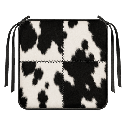 Black and ivory genuine cowhide square chair pad with leather border and tie straps on transparent background