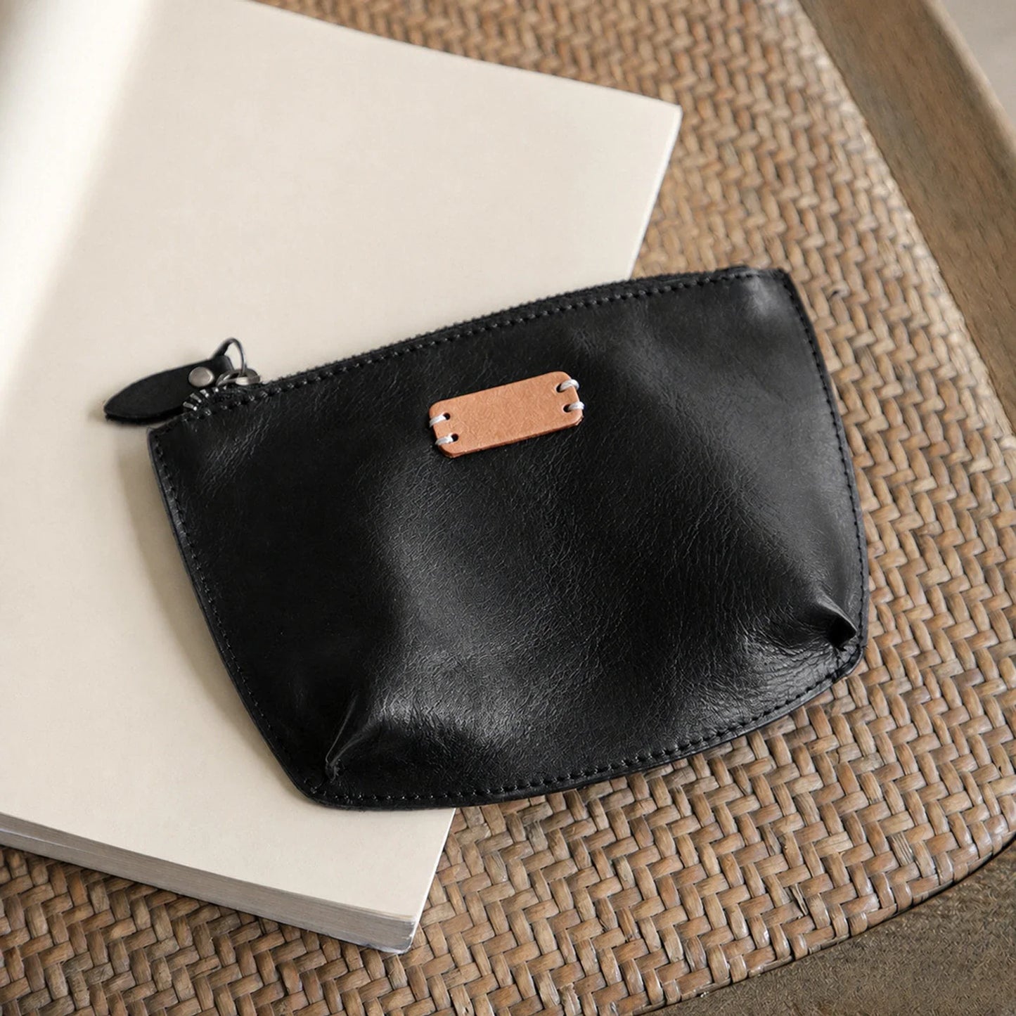 Black vegetable-tanned top-grain leather cosmetic pouch